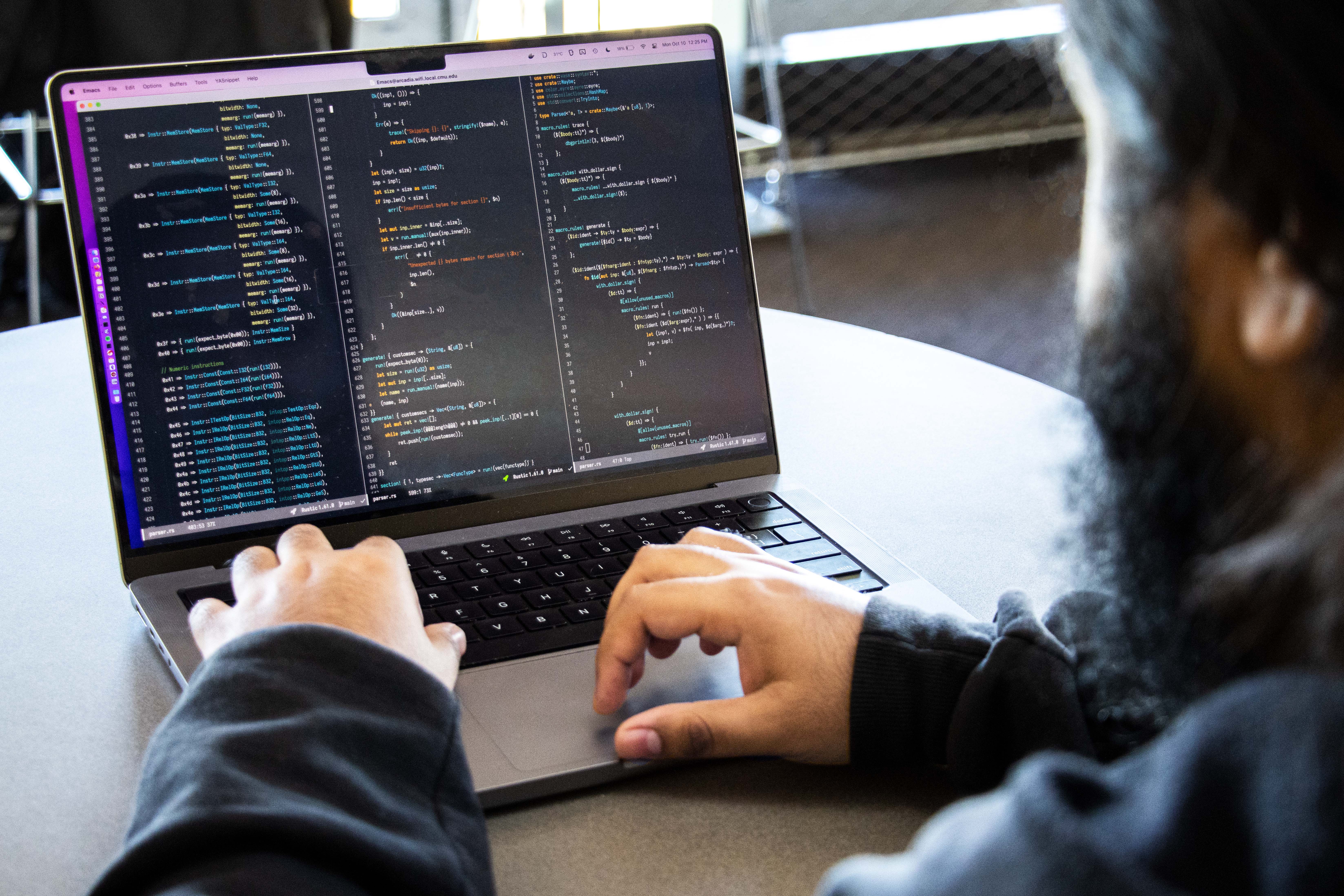 Jay Bosamiya works on his computer in the Gates Hillman building on Carnegie Mellon's Pittsburgh campus
