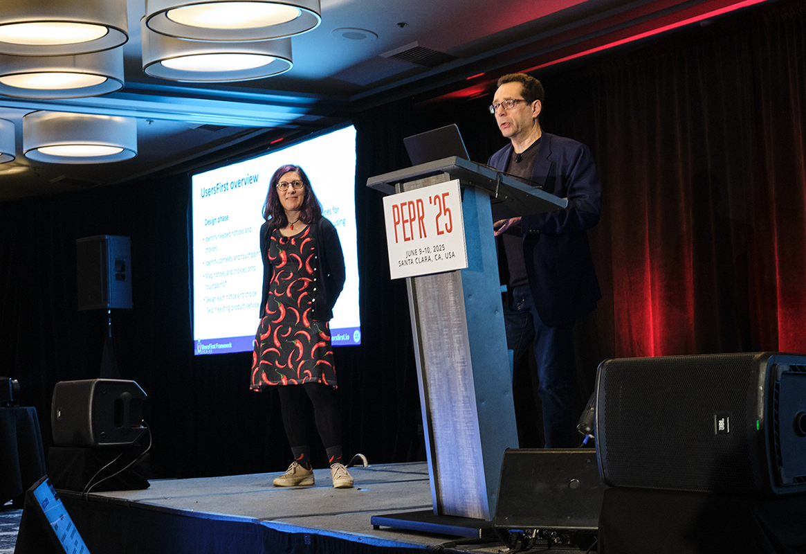 Photo of Lorrie Cranor and Norman Sadeh presenting at PEPR '25