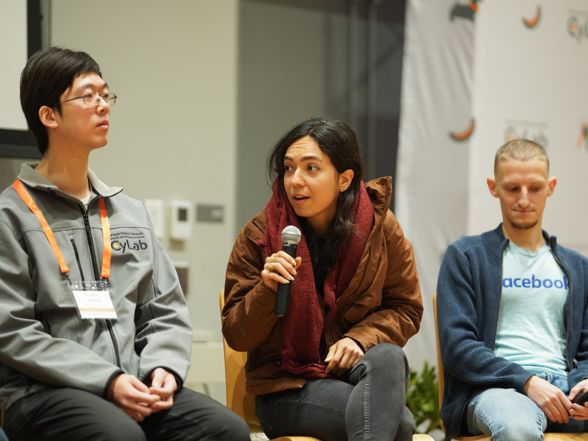 Photo of Niloofar Mireshghallah speaking during a panel at the CyLab Partners Conference