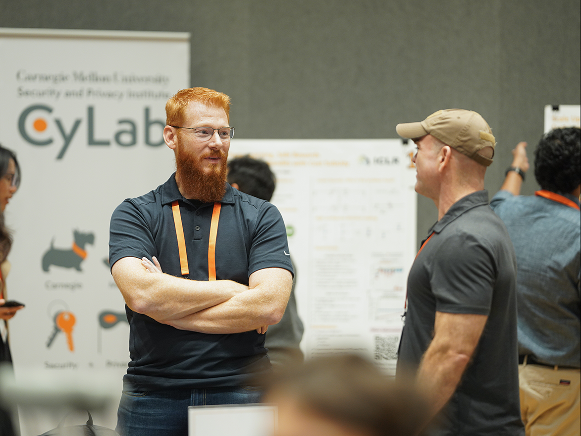 Photo of two people talking to each other during a networking session at the CyLab Partners Conference