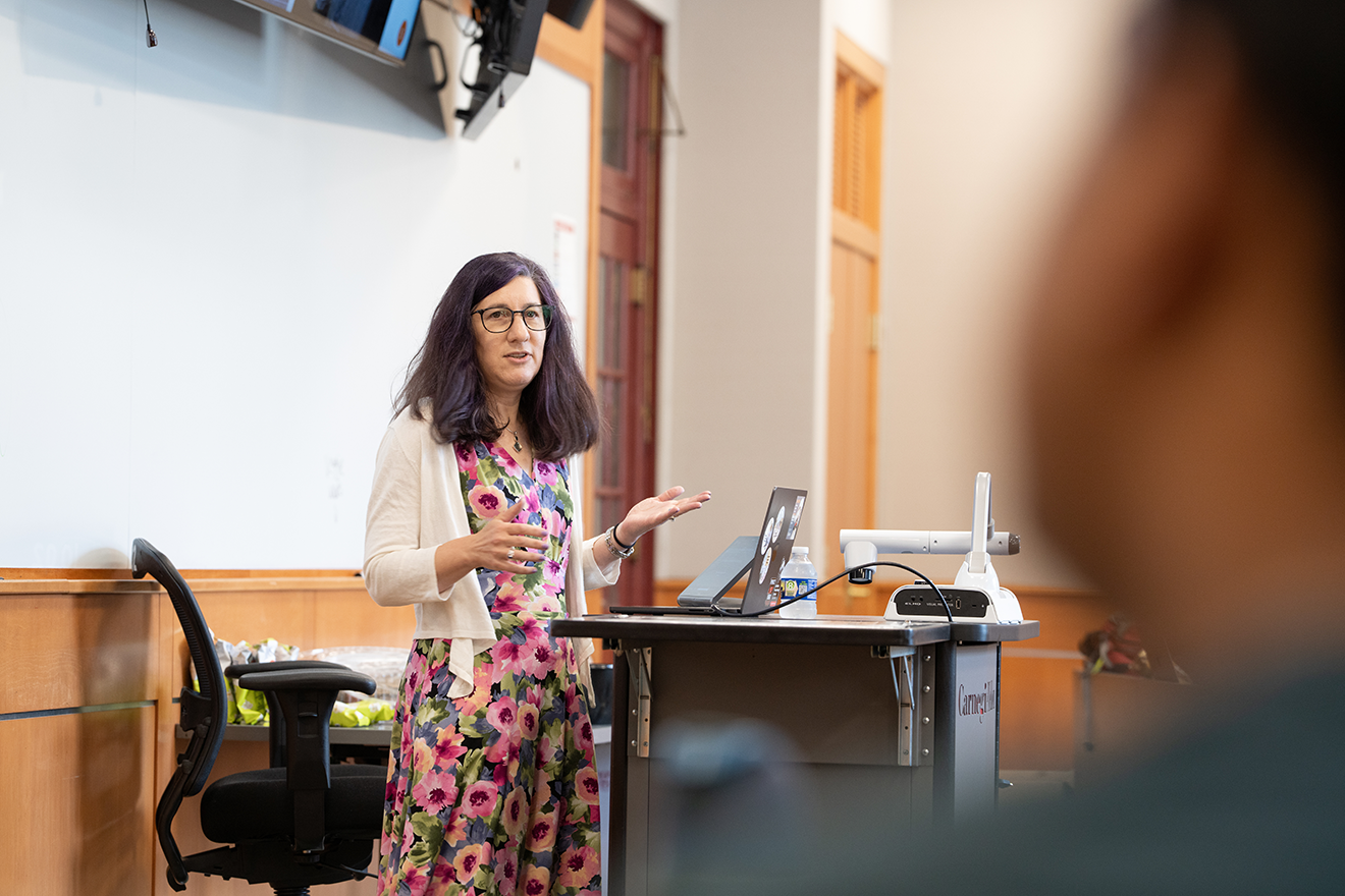 photo of Lorrie Cranor standing at a Carnegie Mellon University podium giving a guest lecture